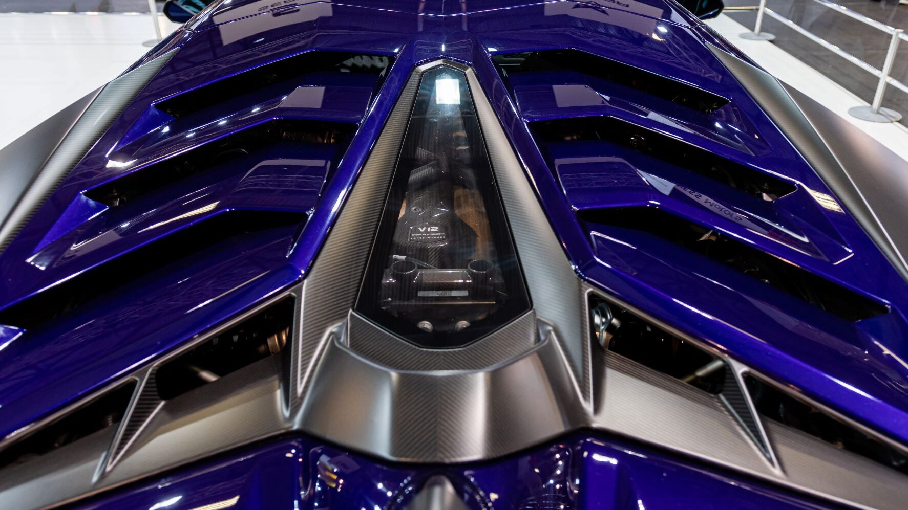 Blue Lamborghini Aventador close up of engine area