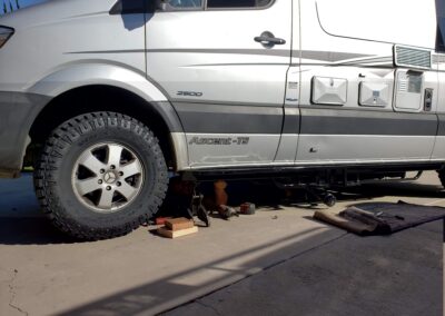 Sprinter van getting custom rock guards & skid pans installed