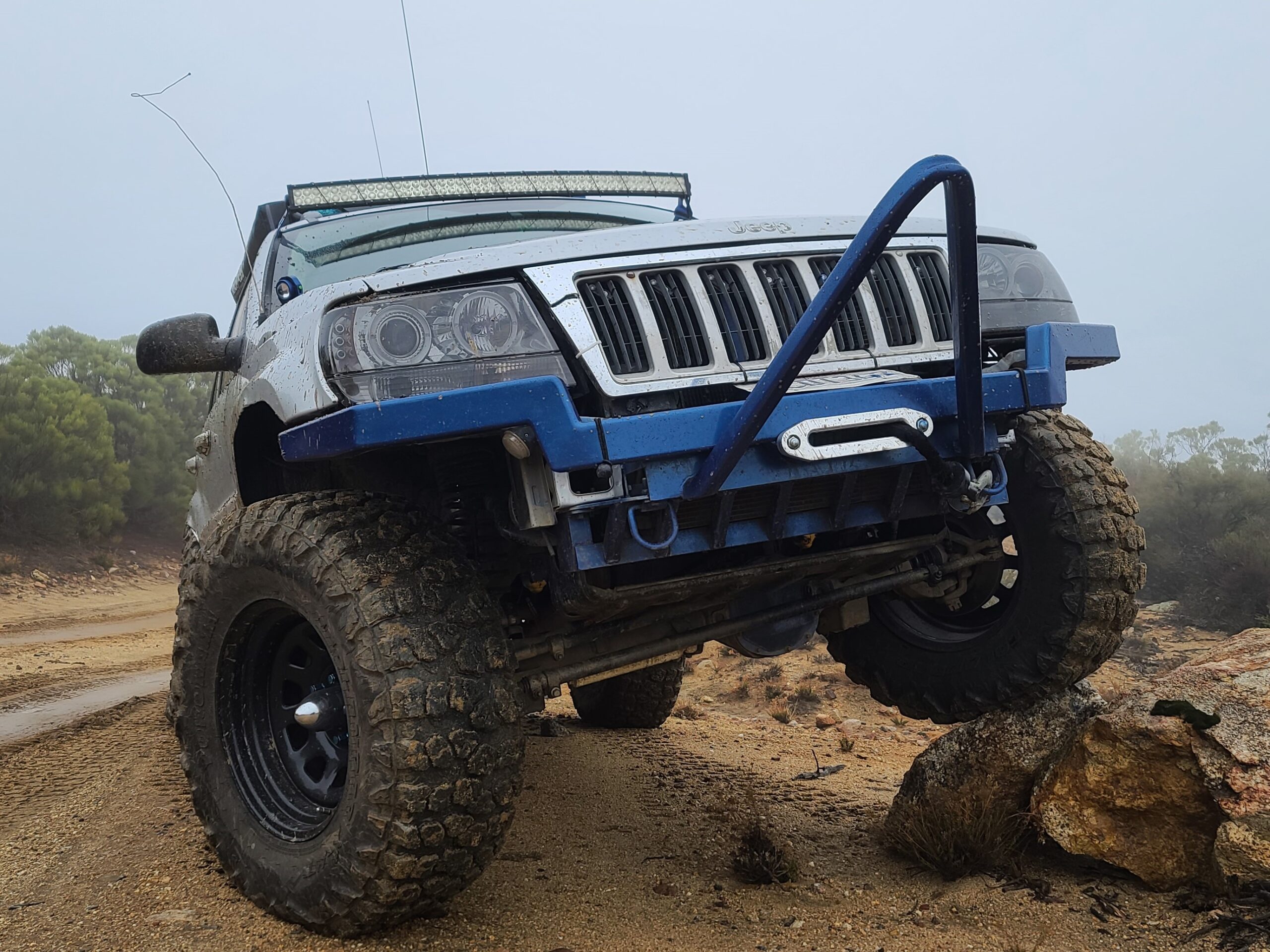 Jeep WJ, low front view showing custom bumper